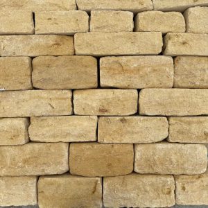 Cotswold stone cladding image showing rows of cladding stone, colours & textures